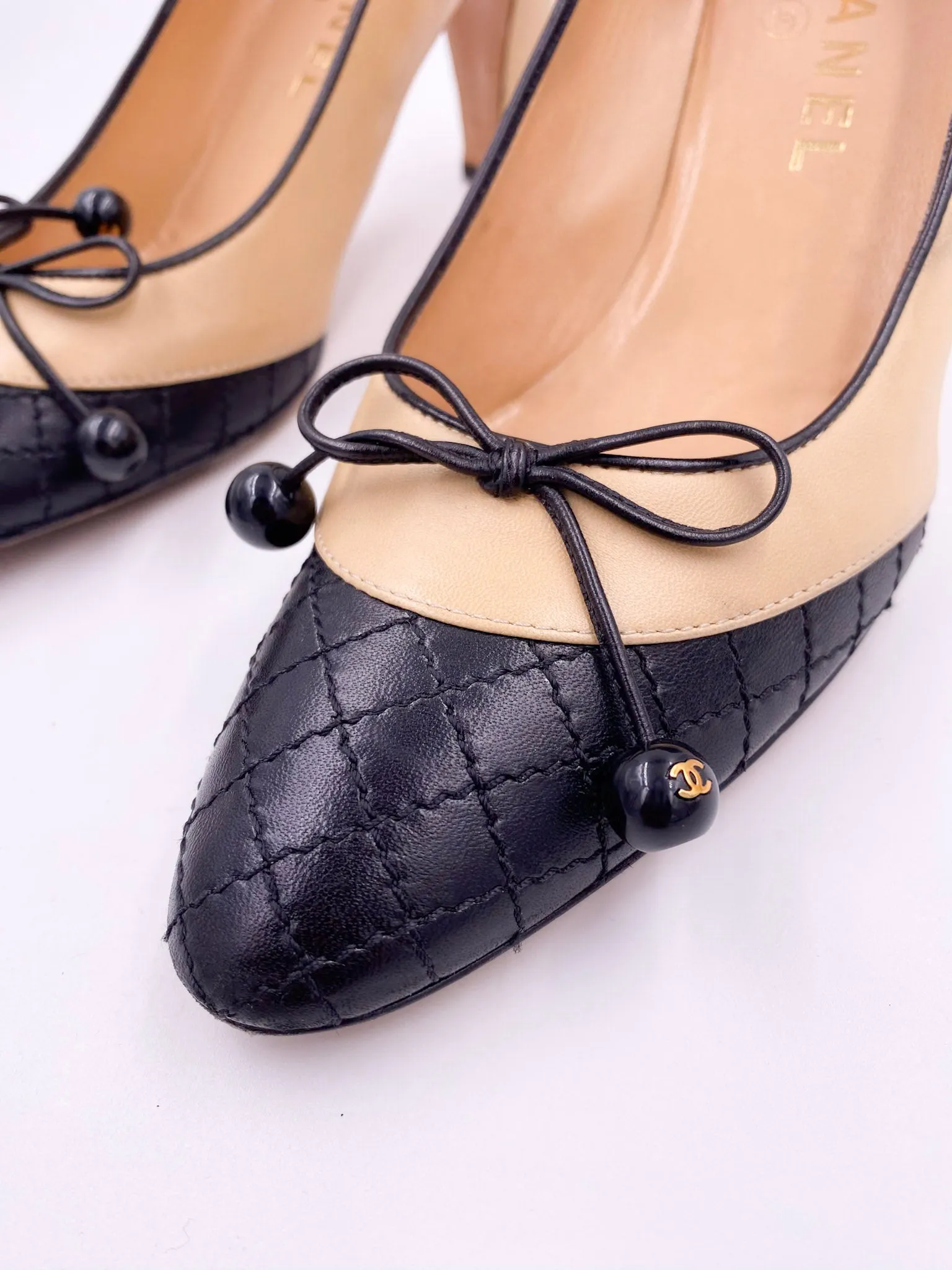 Chanel Beige Pump with Black Quilted Toe